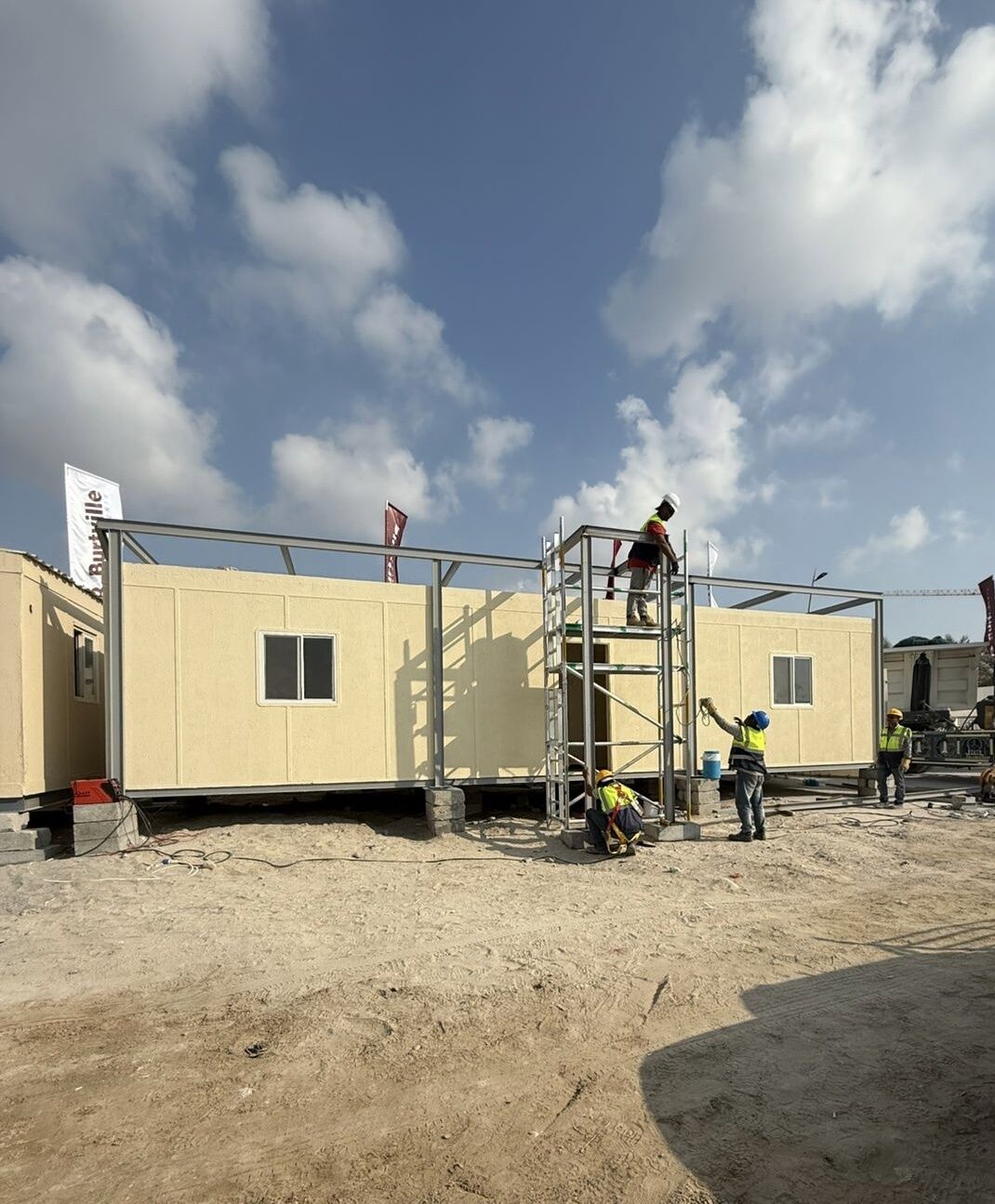 Al Meeqaat team installing a modular building on site